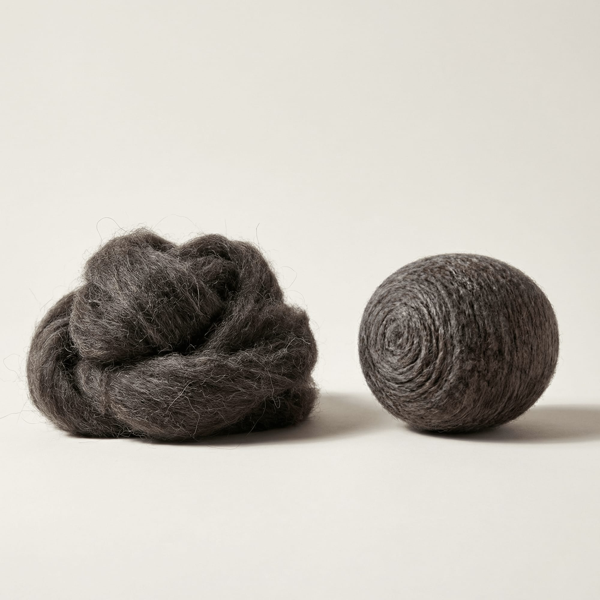 Natural dark charcoal Merino wool — raw fiber to finished dryer ball